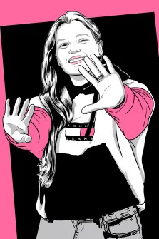 Женский портрет в стиле поп-арт. На портрете в стиле поп-арт изображена улыбающаяся девушка с длинными светлыми волосами; она одета в чёрный топ с логотипом «Tommy Jeans», розовые рукава и светлые джинсы, а её руки энергично вытянуты вперёд, будто она взаимодействует со зрителем. Контрастный фон — ярко-розовый по краям и чёрный в центре — подчёркивает динамичность и выразительность образа. Художник: Олеся 