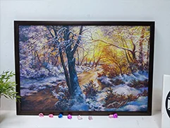 Пример печати на холсте картины с зимним пейзажем в рамке.